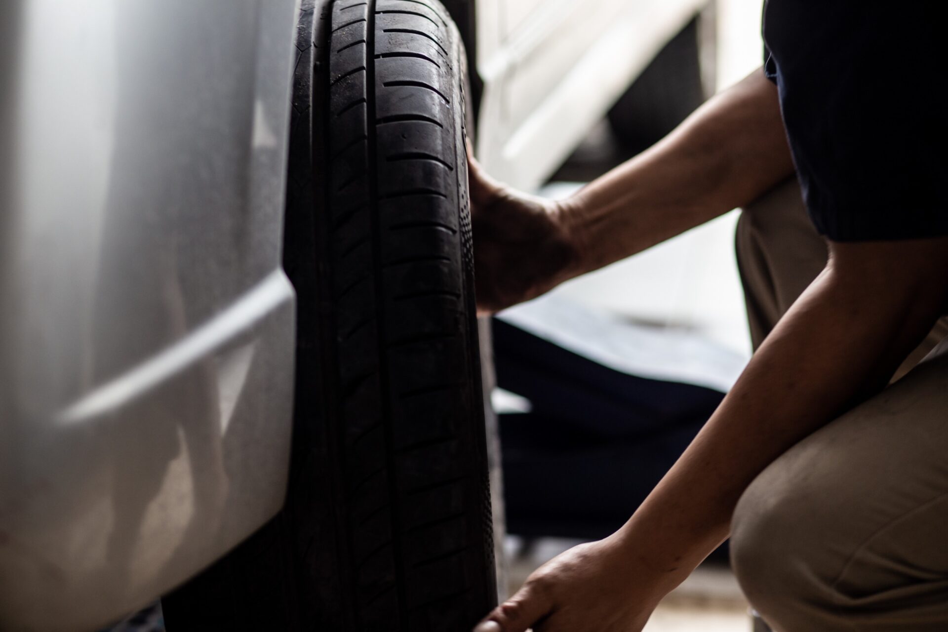 Car tire chang and check working in garage new tire Car tire chang and check working in garage new tire